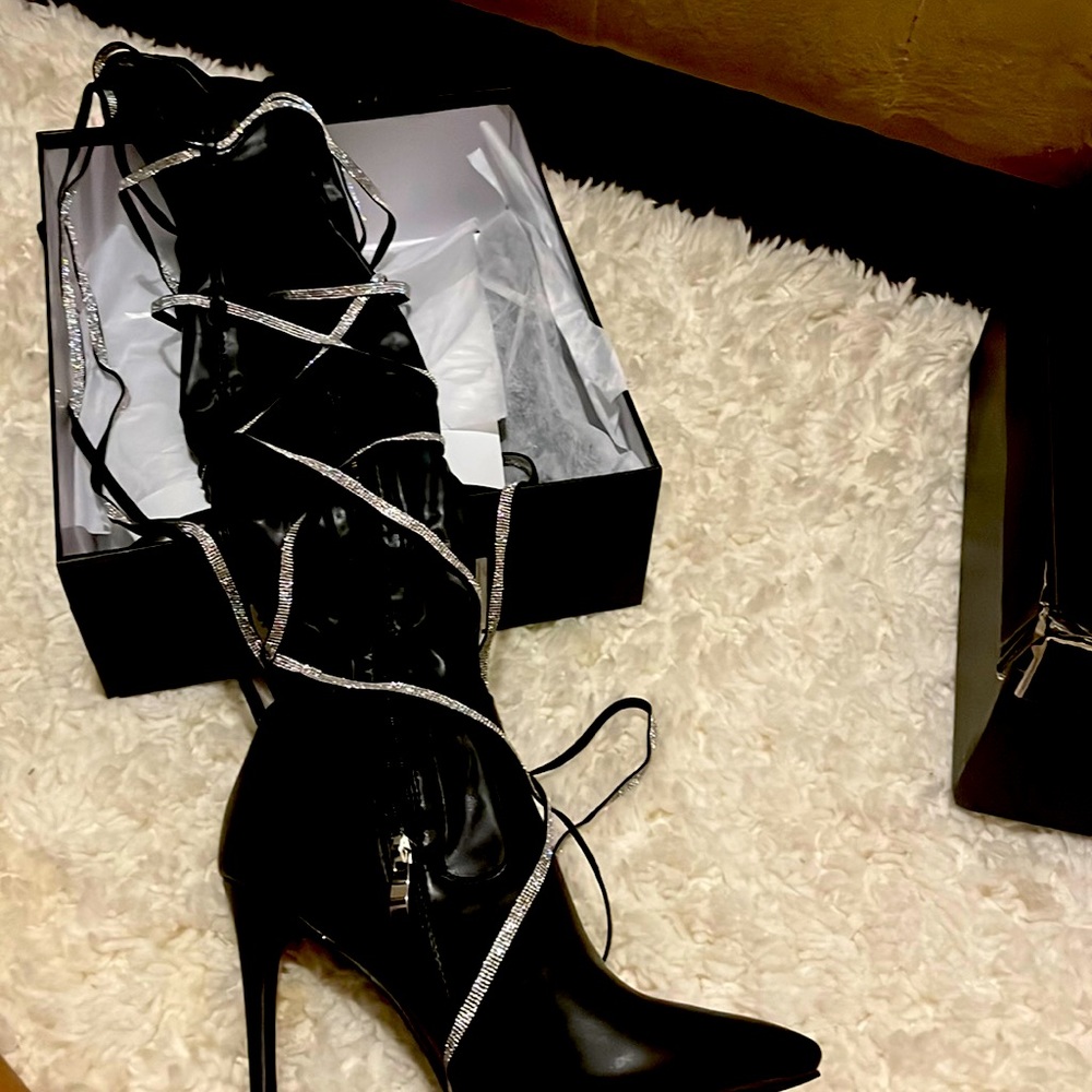 Tall black boots with glittery lace up decor